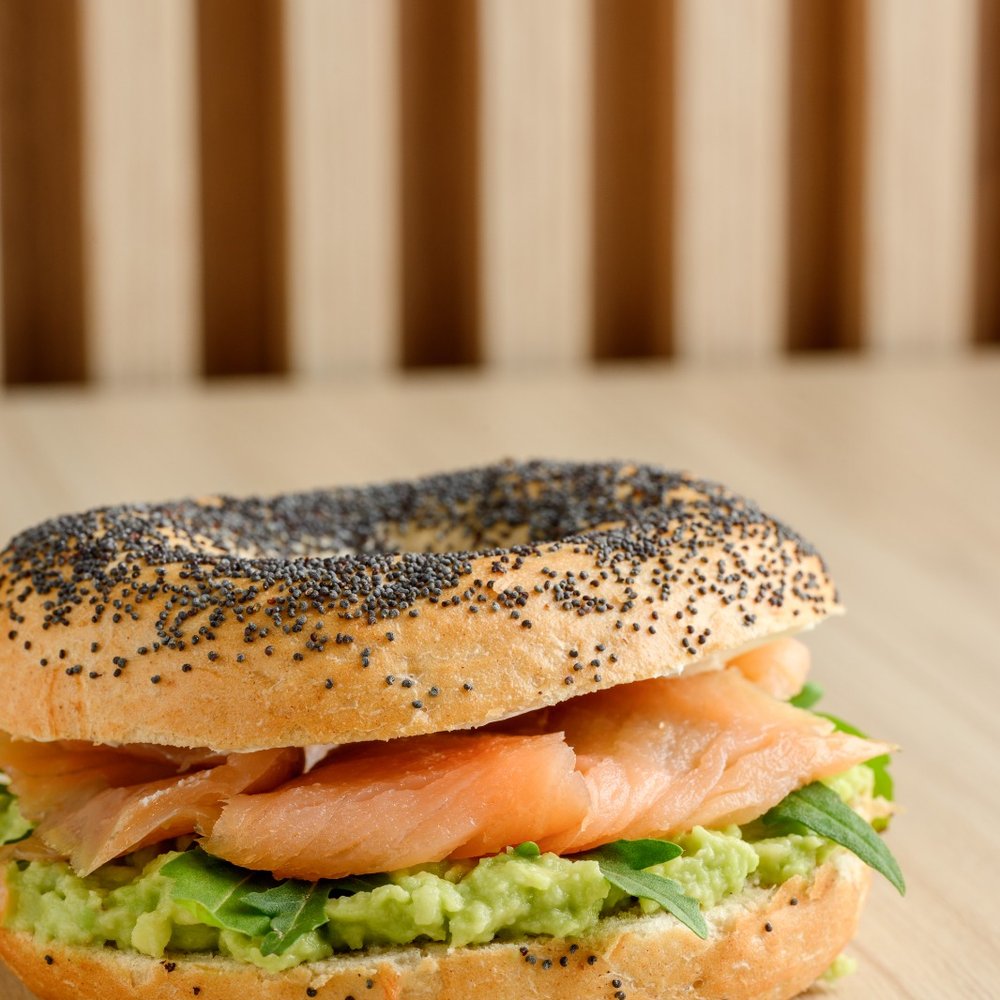 Smoked salmon bagel with avocado and cream cheese